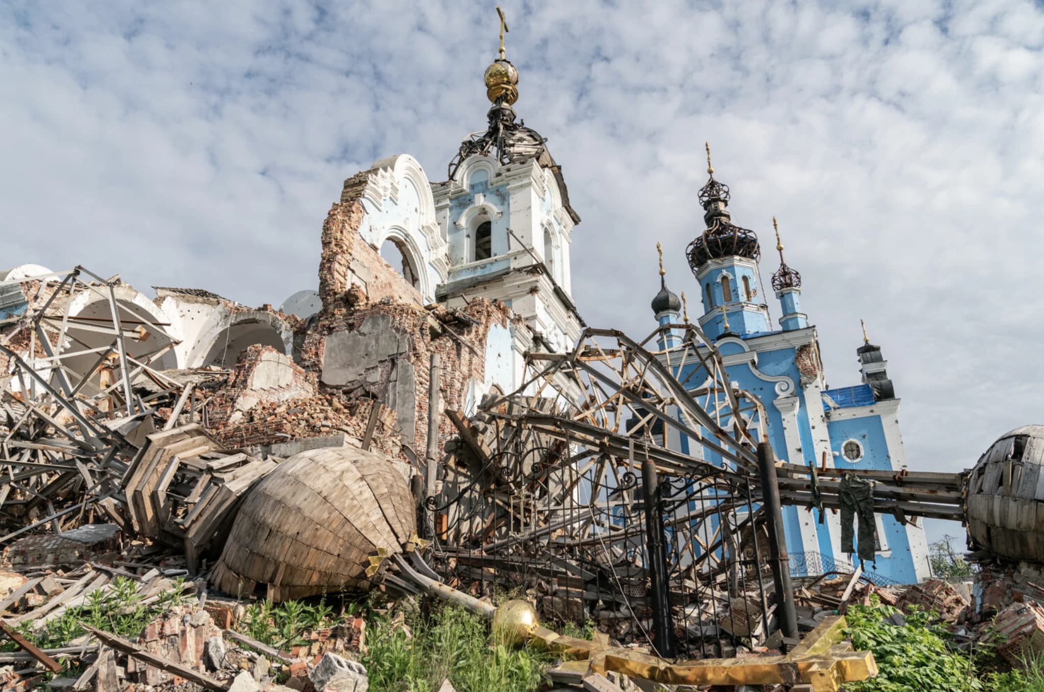 A heavily damaged blue Ukrainian church